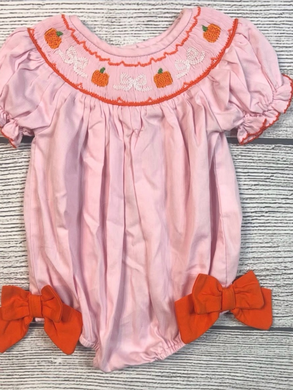 Pink Smocked Bubble Romper with Orange Pumpkin Accents